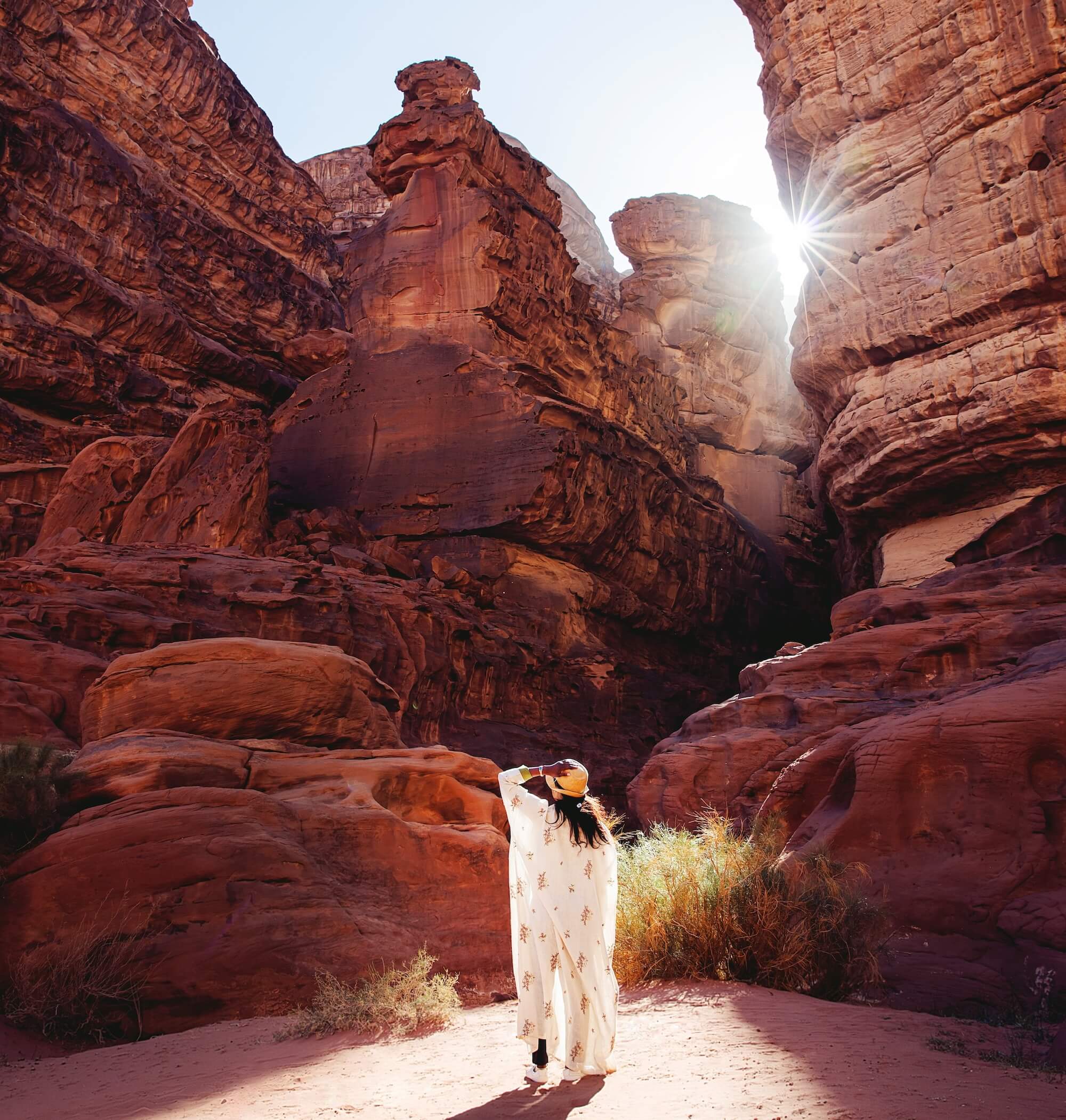 A young woman looks up to find her way.