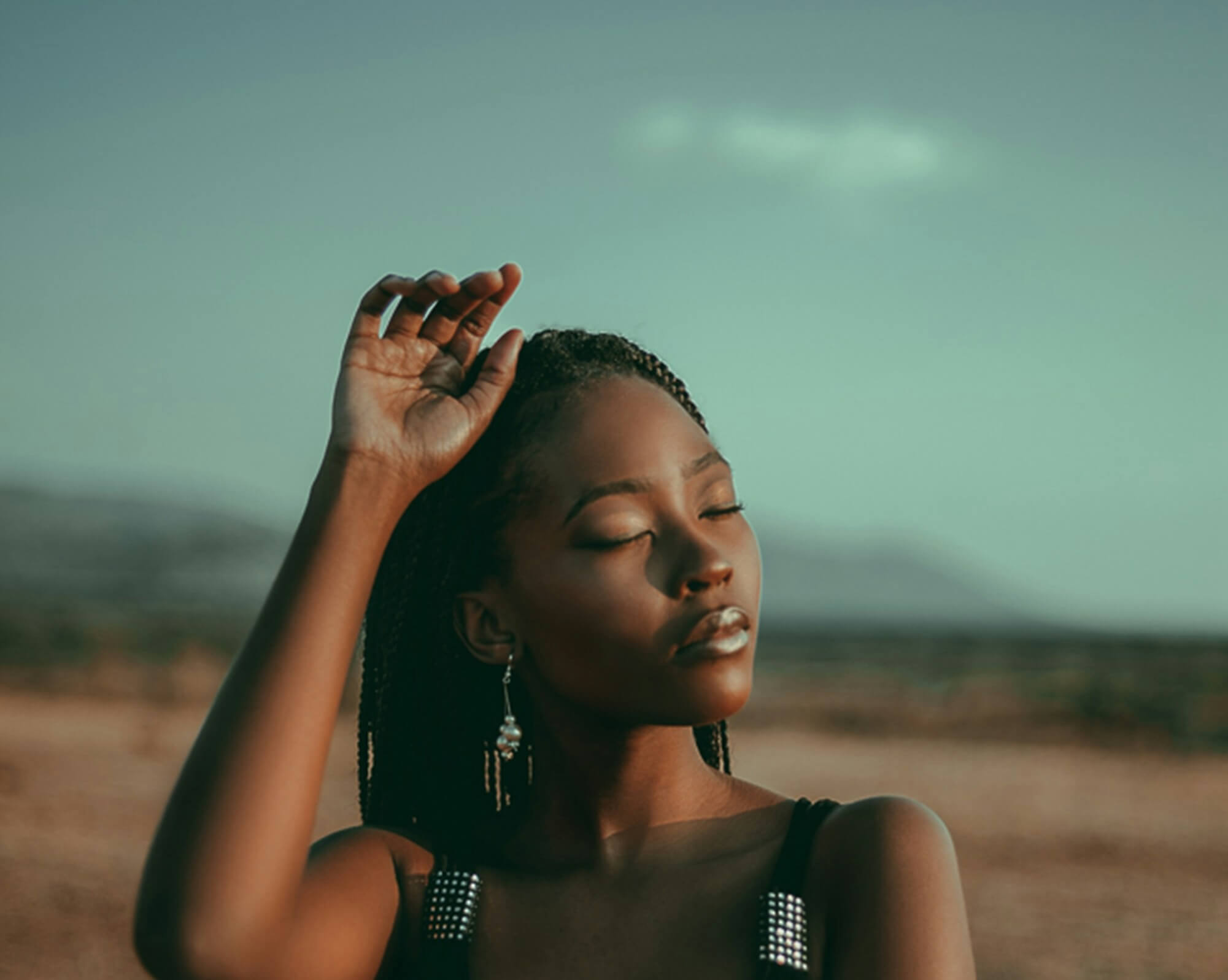A woman softens in the golden hour sunlight